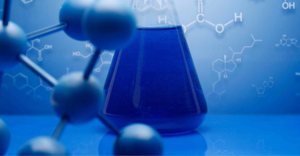 Blue liquid chemical in a laboratory with molecular models and chemical bonds.