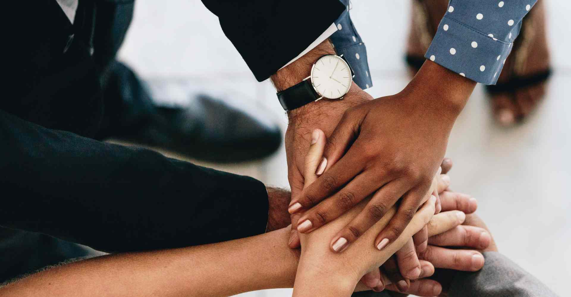 Team hands stacked on top of each other