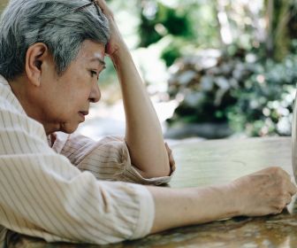 An Asian American elder experiencing the lifelong effects of toxic stress.